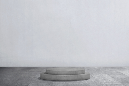 Empty podium with gray wall backgroundの写真素材