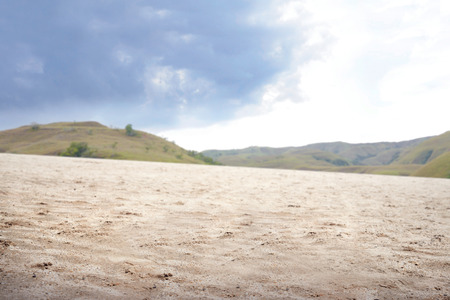 Sand dune with green hills view backgroundの写真素材
