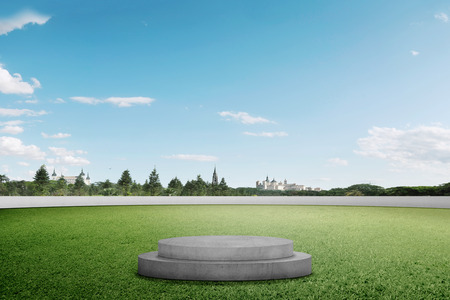 Podium on green grass at outdoorの写真素材
