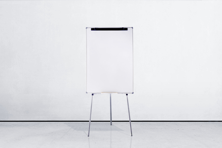 Standing white board inside room with white wall backgroundの写真素材