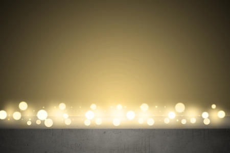 Concrete table with bright lights backgroundの写真素材