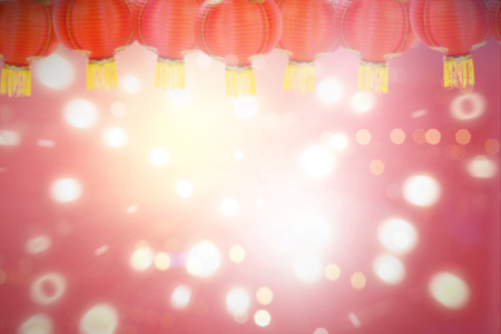 Red lanterns hanging over blur lights background. Chinese New Year Backgroundの写真素材