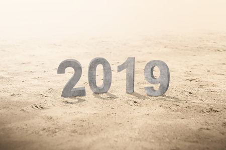 Number of 2019 standing on the sand. Happy New Year 2019