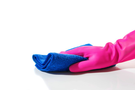 Man in gloves using rag cloth to clean posing isolated over white backgroundの写真素材