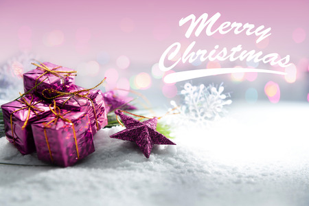 Colored gift box and stars on the snow. Merry Christmasの写真素材
