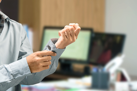 Businessman tidy up the shirt on the office roomの写真素材