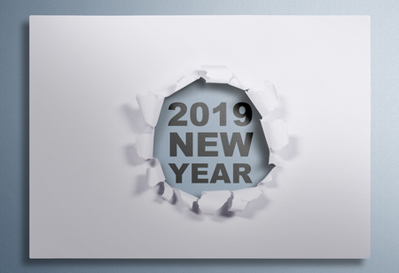 2019 New Year message showing under white ripped paper. Happy New Year 2019の写真素材