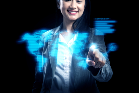 Attractive asian business woman pointing business connection on virtual screen. Business conceptの写真素材