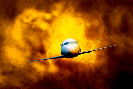Airplane flying through turbulence cloud on the skyの写真素材