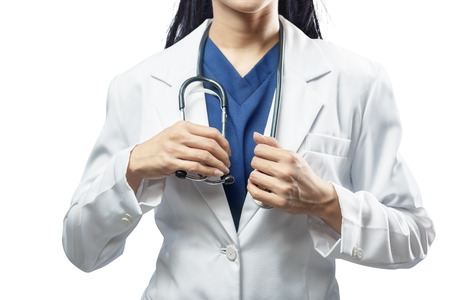 Medical doctor woman with stethoscope on her neck posing isolated over white backgroundの写真素材