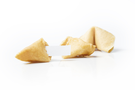 Fortune cookies with blank white paper isolated over white backgroundの写真素材