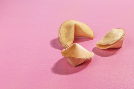 Three of fortune cookies on the pink backgroundの写真素材