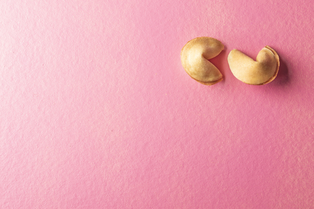 Two fortune cookies on the pink backgroundの写真素材