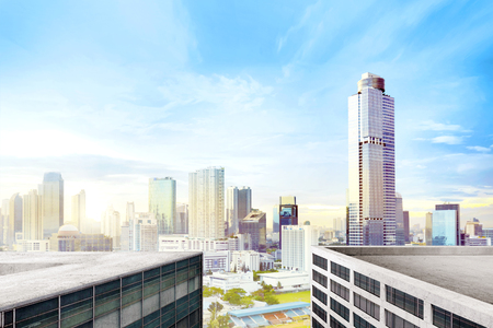 Modern city with high skyscrapers over blue sky backgroundの写真素材