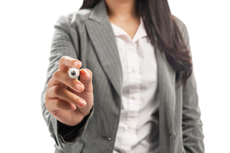 Business woman writing something with marker posing isolated over white backgroundの写真素材