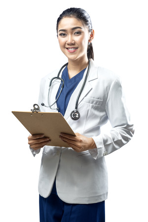 Portrait of asian woman doctor in white coat and stethoscope holding clipboard isolated over white backgroundの写真素材