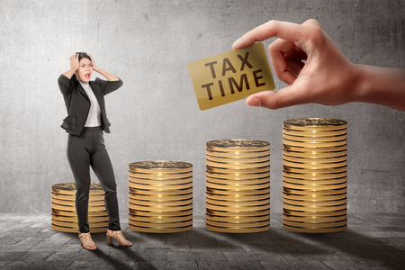 Young asian business woman feeling stressed because Tax time deadline. Taxes conceptの写真素材