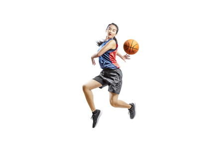 Pretty asian woman playing basketball posing isolated over white backgroundの写真素材