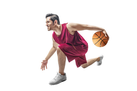 Handsome asian man playing basketball isolated over white backgroundの写真素材