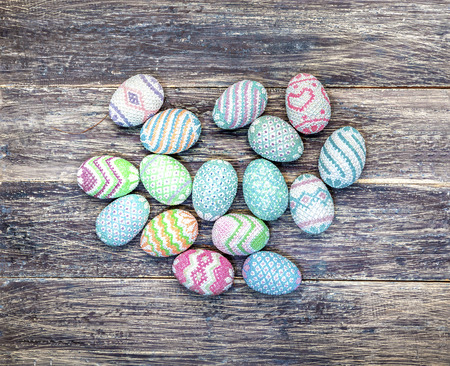 Colorful easter eggs on the wooden table. Happy Easterの写真素材