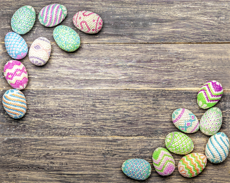 Colorful easter eggs with copyspace on the wooden table. Happy Easterの写真素材