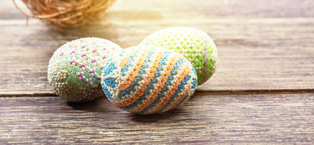 Close up view of Colorful easter eggs and nest on wooden table. Happy Easterの写真素材