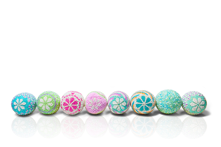 Row of Colorful easter eggs isolated over white background. Happy Easterの写真素材