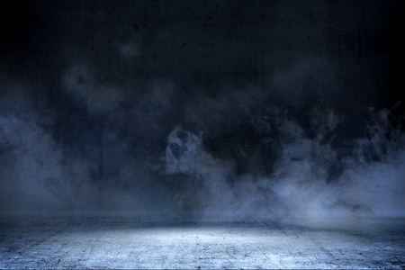 Room with concrete floor and smoke with dark wall backgroundの写真素材