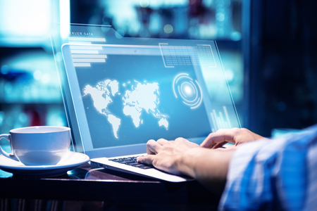 Businessman working using laptop with virtual screen display the server data, worldwide map, binary and chart bar with coffee on the table at office room background. Cyber security and privacy. General Data Protection Regulation (GDPR) conceptの写真素材