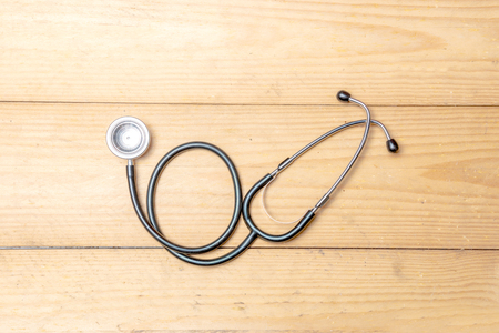 Stethoscope on the wooden table. Health day conceptの写真素材