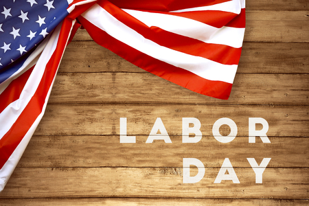 USA Flag and a Labor day text on wooden background. Labor day conceptの写真素材