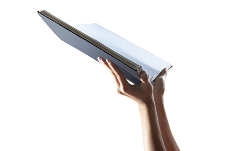 Muslim hands holding quran open isolated over white backgroundの写真素材
