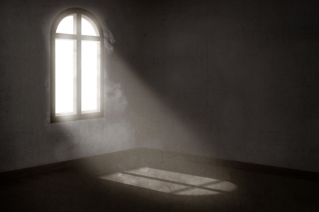 Light from outside the windows illuminate the dark roomの写真素材