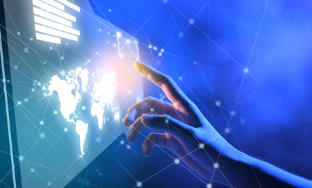 Business finger touching a virtual screen which display the interface of server data, world maps, graph and binary code with internet network background. Digital technology conceptの写真素材
