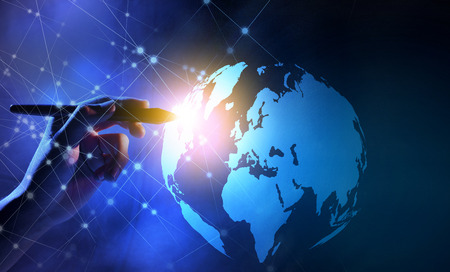 Business hand with markers touching a globe on virtual screen with internet network background. Digital technology conceptの写真素材