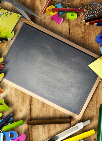School supplies and stationery with little blackboard on wooden table with copyspace. Back to School conceptの写真素材