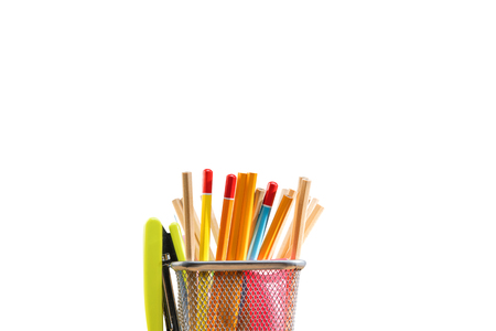 Pencils in basket container with green stapler isolated over white background. Back to School conceptの写真素材