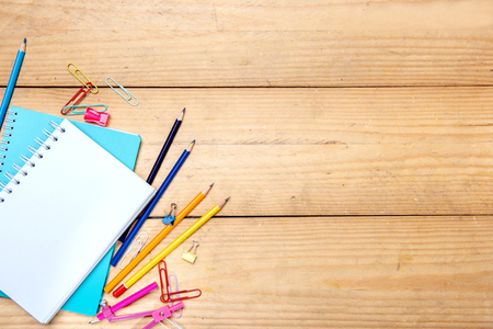 Notebooks with school supplies and stationery on the wooden table. Back to School conceptの写真素材