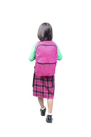 Rear view of asian cute girl with pink backpack standing posing isolated over white background. Back to School conceptの写真素材