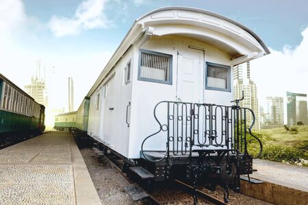 Train wagon with exclusive wagon train in a station with city and blue sky backgroundの写真素材