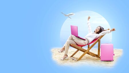 Asian business woman relax when working with laptop sitting in the beach chair on beach with plane on the sky. Traveling conceptの写真素材
