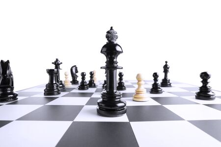 Black and white chess pieces on the chessboardの写真素材