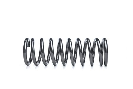 Black coil spring isolated over white backgroundの写真素材