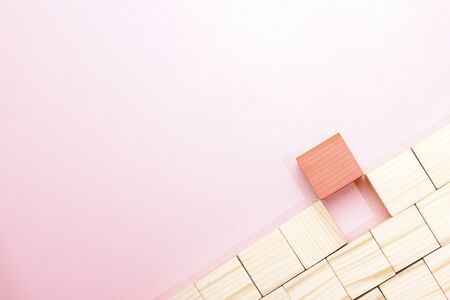 Wooden block toy over pink background