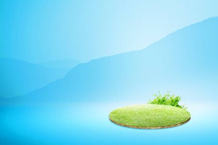 Green grass over blue backgroundの写真素材