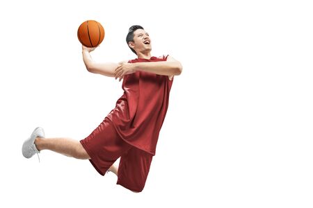 Asian man basketball player jump in the air with the ball isolated over white backgroundの写真素材