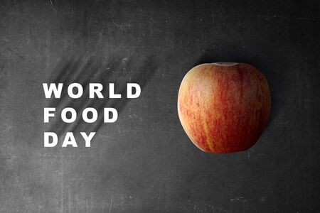 Apple fruit with World Food Day text on black background. World Food Dayの写真素材