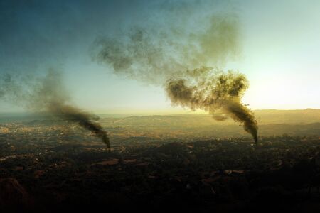 Dark smoke from forest fires cause pollution on the air in the rural scene