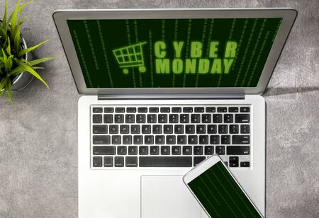 Cyber Monday advert on the laptop screen on the desk. Cyber Monday conceptの写真素材