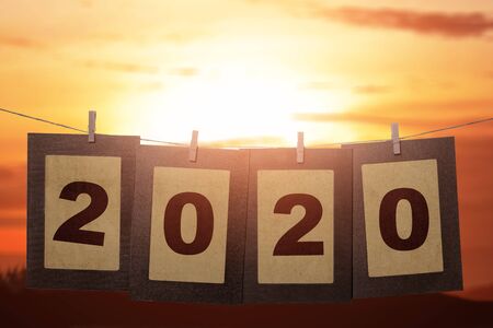 2020 on the cardboard hanging with rope. Happy New Year 2020